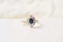 https://cdn.shopify.com/s/files/1/0963/7950/2920/files/bague-marguerite-or-blanc_664ea675-c2f5-43b0-a86e-e8ec6f2acbec.jpg?v=1784552677