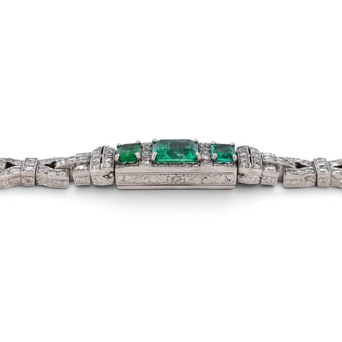 https://cdn.shopify.com/s/files/1/1015/8633/8124/files/antique-art-deco-platinum-emerald-diamond-bracelet-engraving-detail.jpg?v=1785511797