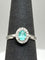 55 Bague en or blanc 18k avec tourmaline Paraíba et diamants 58 Facettes ANELLO PARAIBA OVALE