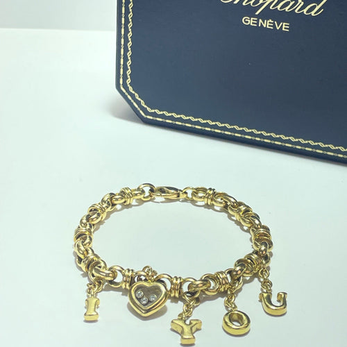 Bracelet Chopard Genève - Bracelet à breloques en or jaune 3 diamants 58 Facettes 250056