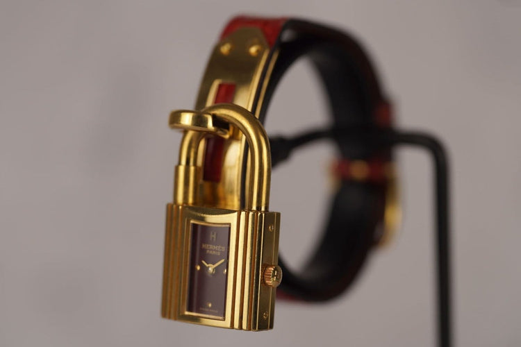 Montre Hermès Kelly - Montre plaqué or cadran bordeaux 58 Facettes TOT-11128