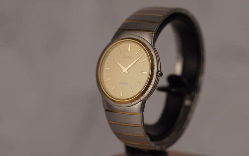 Montre Seiko Laurel - Montre unisexe acier et lunette or jaune 58 Facettes TOT-10679