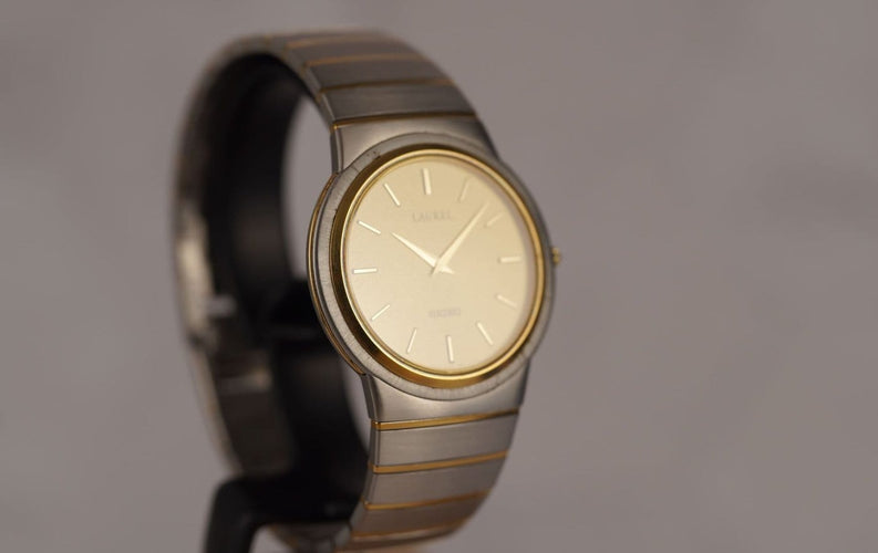 Montre Seiko Laurel - Montre unisexe acier et lunette or jaune 58 Facettes TOT-10679