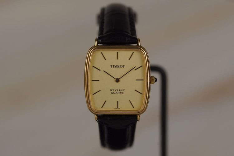 Montre Tissot Stylist - Montre tonneau plaqué or 58 Facettes TOT-11041