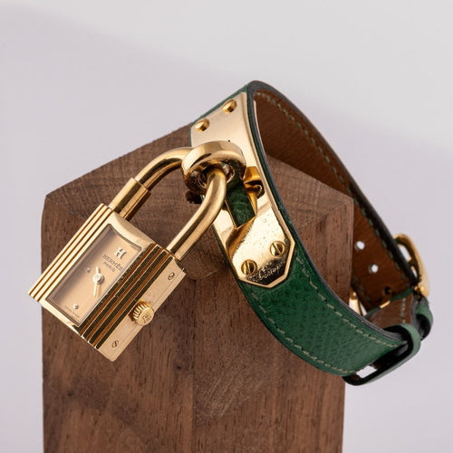 Montre Hermès Kelly - Montre plaqué or cuir vert 58 Facettes TOT-02370