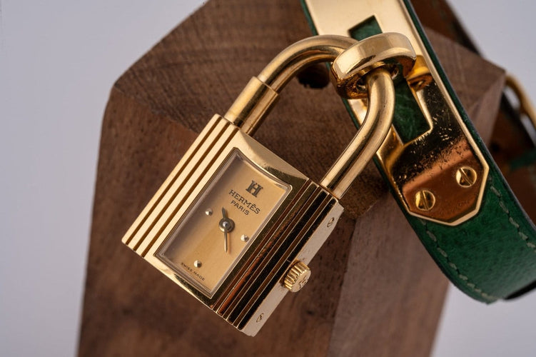 Montre Hermès Kelly - Montre plaqué or cuir vert 58 Facettes TOT-02370