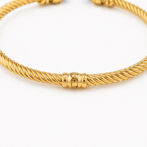 https://18carats.fr/wp-content/uploads/2026/05/36969-36973-Bracelet-jonc-torsade-en-or-jaune-amethystes-et-diamants.png