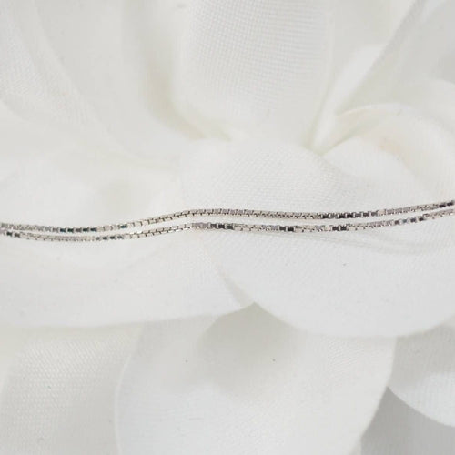 Collier Collier 4 cœurs en or blanc et diamants 58 Facettes 26383