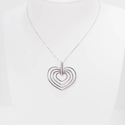 Collier Collier 4 cœurs en or blanc et diamants 58 Facettes 26383