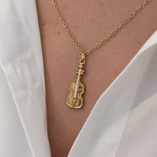 https://18carats.fr/wp-content/uploads/2026/07/38021-38284-Pendentif-violon-en-or-jaune.jpg