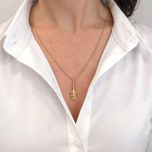 https://18carats.fr/wp-content/uploads/2026/07/38021-38282-Pendentif-violon-en-or-jaune.jpg