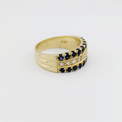 https://18carats.fr/wp-content/uploads/2025/12/33775-34400-Bague-en-or-jaune-diamants-et-saphirs.jpg