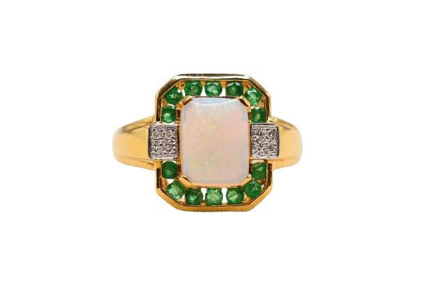 Bague 55 Bague octogonale en or jaune avec opale, émeraudes et diamants 58 Facettes 4232