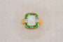 https://cdn.shopify.com/s/files/1/0963/7950/2920/files/bague-en-or-jaune-ornee-d-une-opale-rectangulaire-entouree-d-emeraudes-rondes-en-serti-rail-et-de-diamants-ronds-bague-de-fiancailles.jpg?v=1791882361