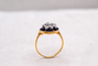 https://cdn.shopify.com/s/files/1/0963/7950/2920/files/bague-en-or-jaune-ornee-d-une-plaque-d-email-bleue-foncee-surmontee-de-diamants-et-d-oxydes-formant-une-etoile-bague-retro.png?v=1791901305