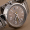 Montre Louis Vuitton - Montre Tambour Q1132 en acier 58 Facettes TOT-12030