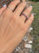 Bague 51.5 Alliance américaine en or gris 18 carats et rubis 58 Facettes 199