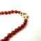 Collier Collier en or jaune 750 et corail 58 Facettes Z1351779