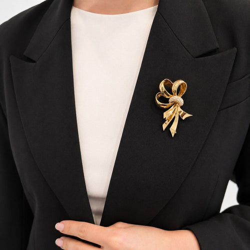 Broche Broche nœud en or jaune 18 carats et diamants 58 Facettes 25564
