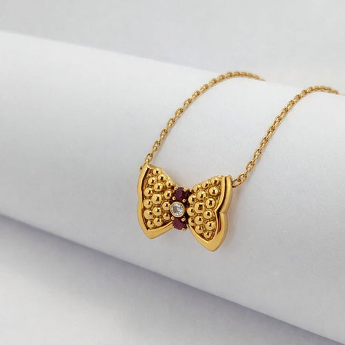 Collier Fred Nœuds - Collier en or jaune, diamant et rubis 58 Facettes 28068