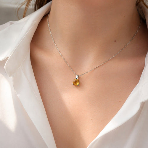 Collier Collier pendentif en or blanc et citrine 58 Facettes 30824