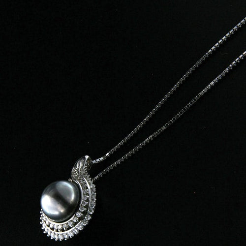 Collier Guidetti - Collier en or blanc avec perle de Tahiti et diamants 58 Facettes G2198