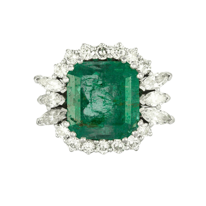 Emerald ring surrounded by diamonds