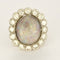 Bague 53.5 Importante bague marguerite en or blanc, opale et diamants 58 Facettes 58FC106