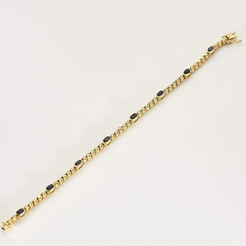 Bracelet Bracelet articulé en or jaune 18k et diamants, saphirs 58 Facettes DADB-16