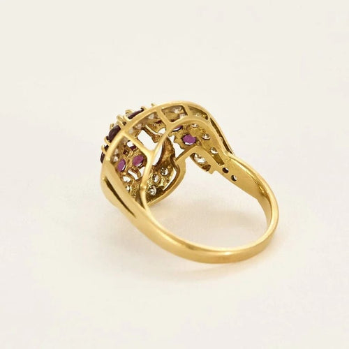 Bague 55 Bague tourbillon en or jaune 18k et rubis, diamants 58 Facettes PL02