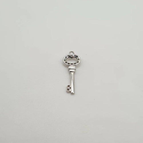 Pendentif Pendentif clef or blanc 18 carats serti de diamants 58 Facettes