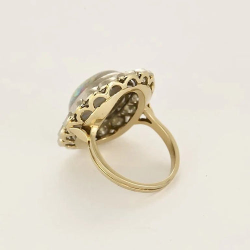 Bague 53.5 Importante bague marguerite en or blanc, opale et diamants 58 Facettes 58FC106