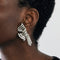 Boucles d'oreilles Boucles d'oreilles clips en platine et diamants taille brillant et baguette 58 Facettes AB34