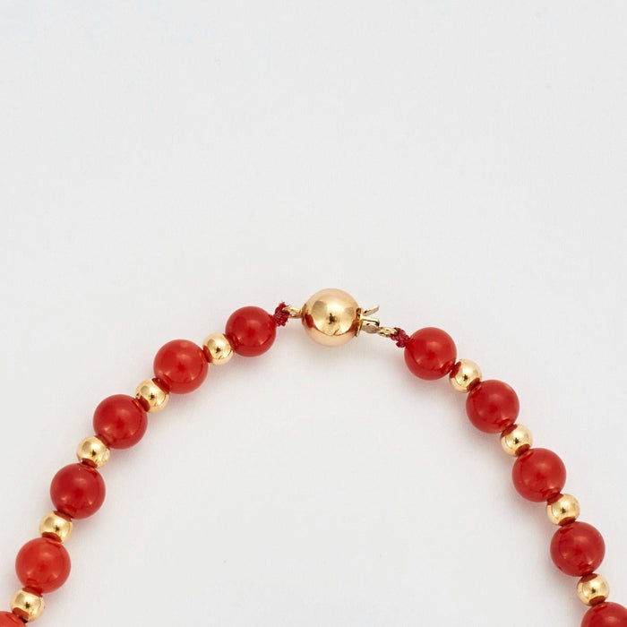 Collier Collier or jaune billes de corail 58 Facettes DV0362-3