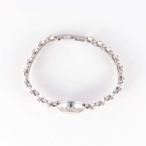 Montre Montre or blanc et diamants 58 Facettes 1