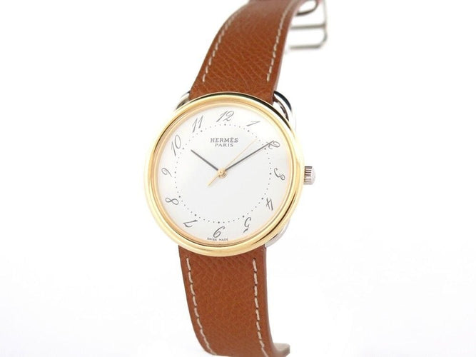 Montre montre HERMES arceau quartz 33 mm or & acier 58 Facettes 254345