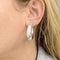 Boucles d'oreilles Créoles Chaumet, "Anneau", or blanc. 58 Facettes 33187