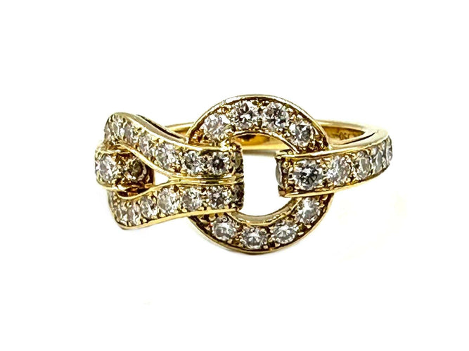 Bague 52 CARTIER. Collection Agrafe, bague en or jaune et diamants 58 Facettes