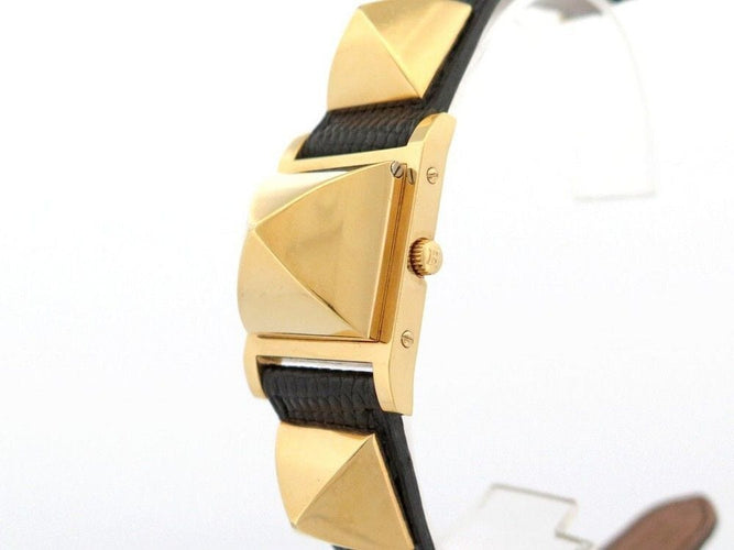 Montre montre HERMES medor 23 mm quartz en plaque or et cuir noir en 58 Facettes 243860