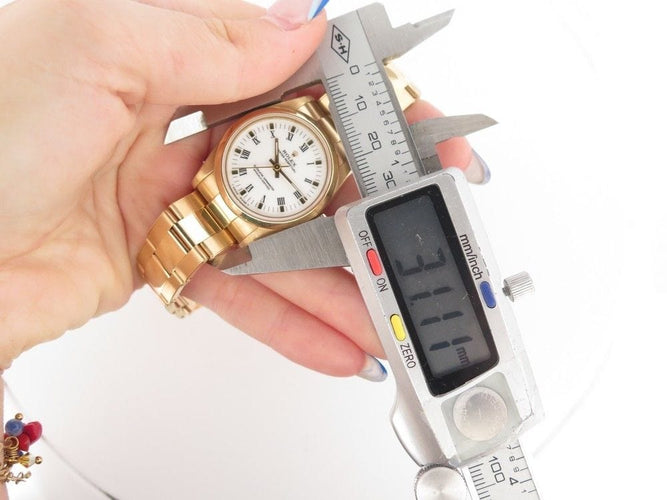 Montre vintage montre ROLEX oyster perpetual 67488 31 mm automatique or jaune 18k 58 Facettes 252911