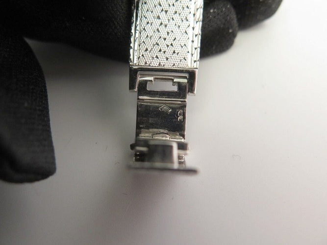 Montre vintage montre EBEL carre en or blanc 18k et diamants 0.4ct mecanique 58 Facettes 250142