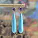 Boucles d'oreilles Boucles d'oreilles pendantes améthystes et turquoises 58 Facettes 22-348