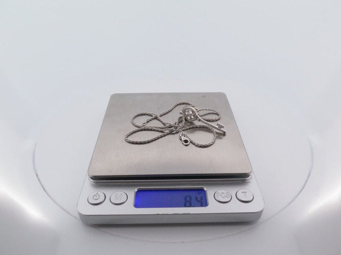 Collier collier pendentif TIFFANY & CO cle rosace platine diamants 58 Facettes 248507