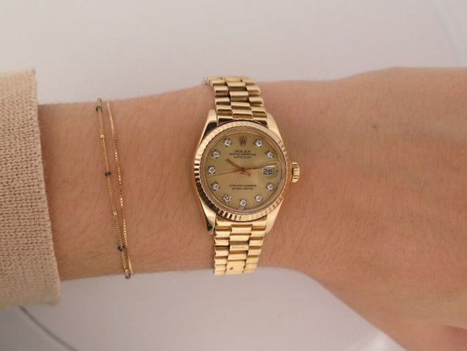 Montre montre ROLEX oyster perpetual lady datejust 26m or jaune 18k diamant 58 Facettes 254467