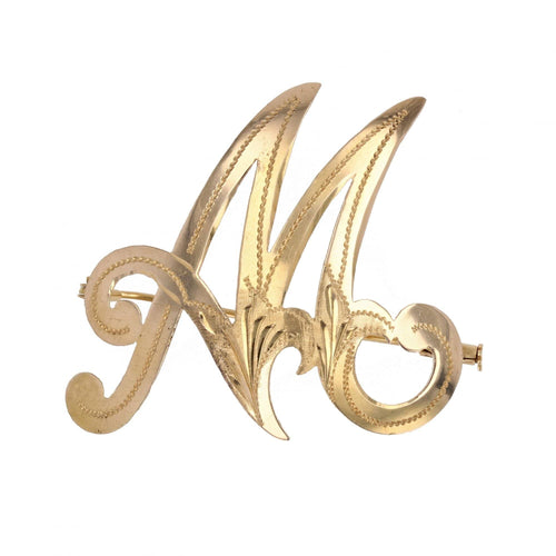 Broche Broche en or lettre M 58 Facettes CVBR48