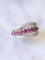 Bague Bague bandeau vintage en or gris, rubis, et diamants 58 Facettes