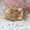 Broche Broche vintage fleur d'or et citrine 58 Facettes 22-446B