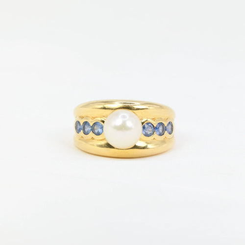 Bague Bague vintage en or jaune, perle et saphirs 58 Facettes 705