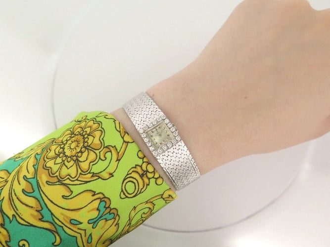 Montre vintage montre EBEL carre en or blanc 18k et diamants 0.4ct mecanique 58 Facettes 250142