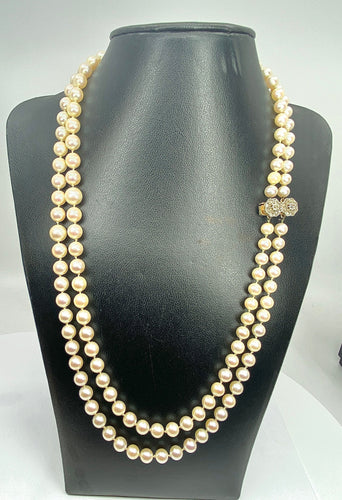 Collier Double collier de perles fermoir diamants. 58 Facettes AB170